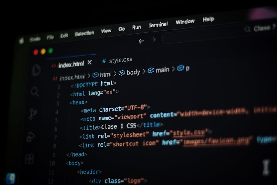 Close-up image of a computer screen displaying lines of HTML code in a code editor, with syntax highlighting in various colors on a dark background. The code includes navigation elements such as 'Prev